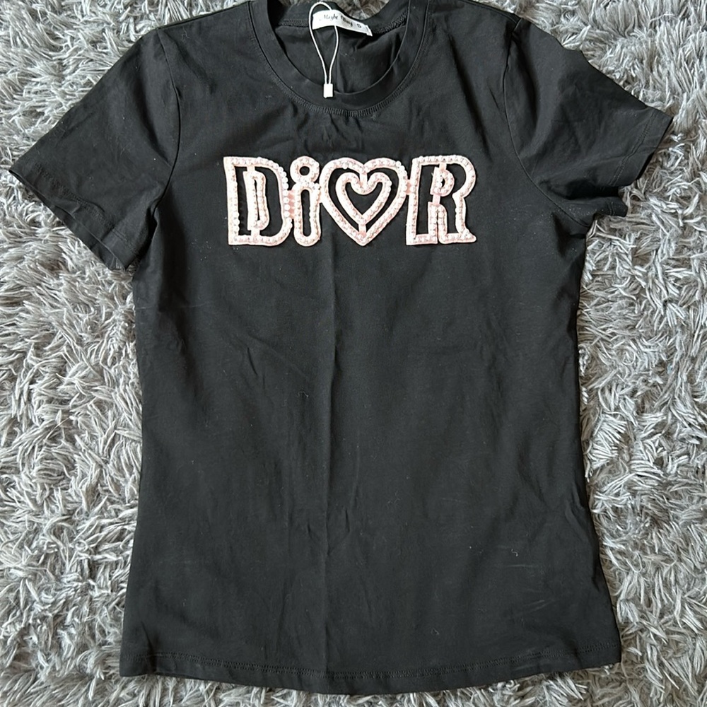 Brand new black tee size small. True small